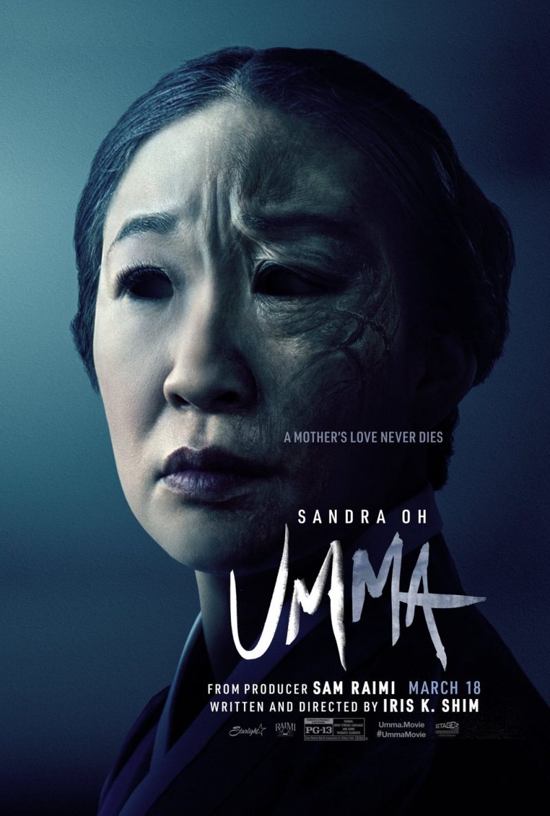 Sandra Oh looks fearful, partially obscured by a dark, ghostly figure in the movie poster for Umma